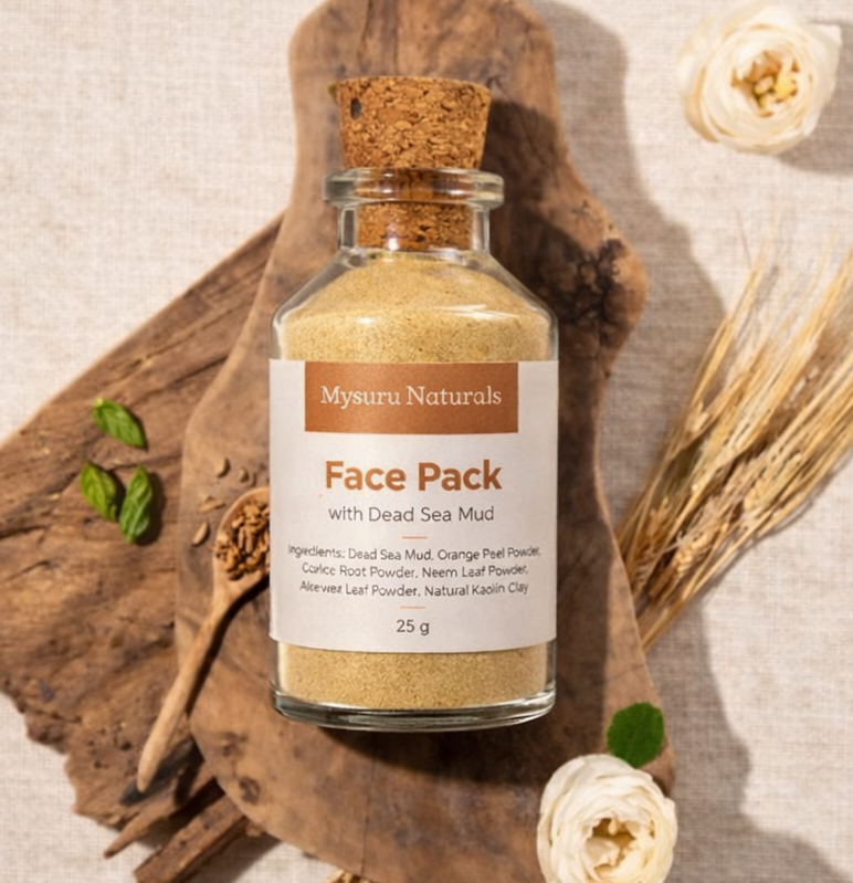 Glass jar of Mysuru Naturals Face Pack with Dead Sea Mud on a wooden background