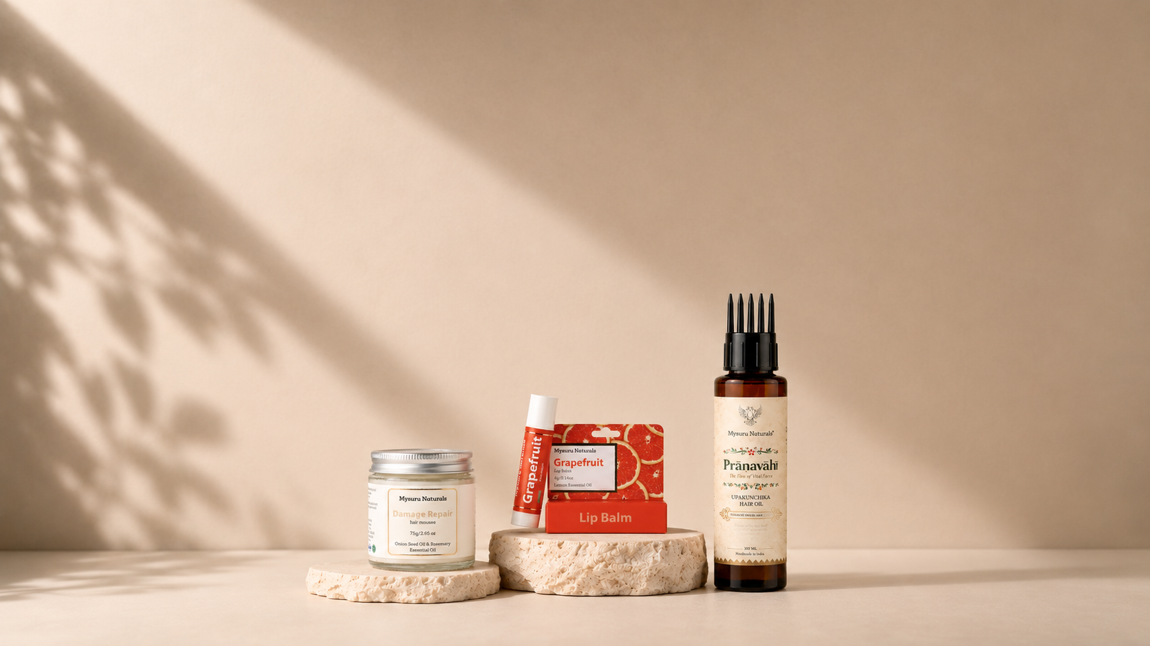 Three skincare products on a neutral background with soft shadows